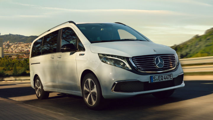 White Mercedes-Benz EQV driving on the road
