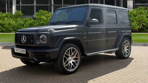 Mercedes-Benz G-Class parked in front of a dealership