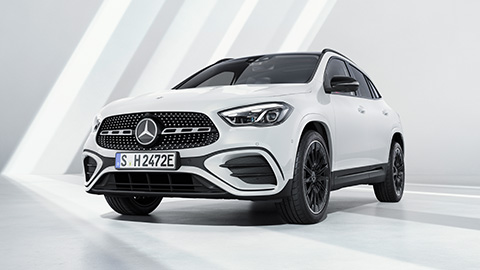 White Mercedes-Benz GLA parked in front of a white wall