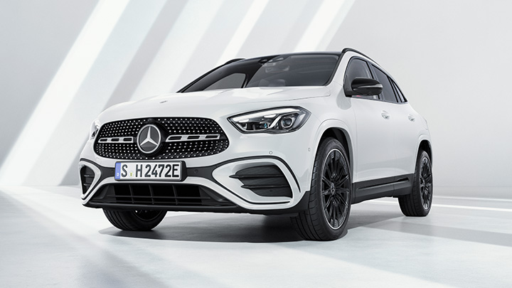 White Mercedes-Benz GLA parked in front of a white wall