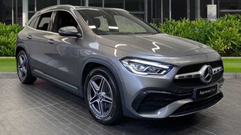 Grey Mercedes-Benz GLA parked in front of a dealership