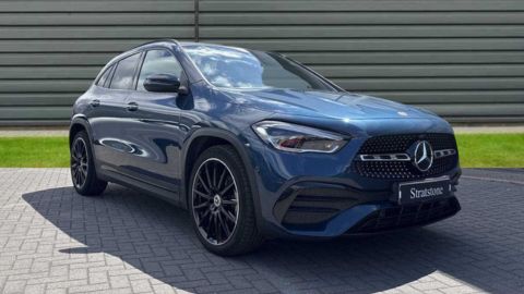 Grey Mercedes-Benz GLA parked in front of a dealership