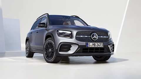 Silver Mercedes-Benz GLB parked in front of a white wall