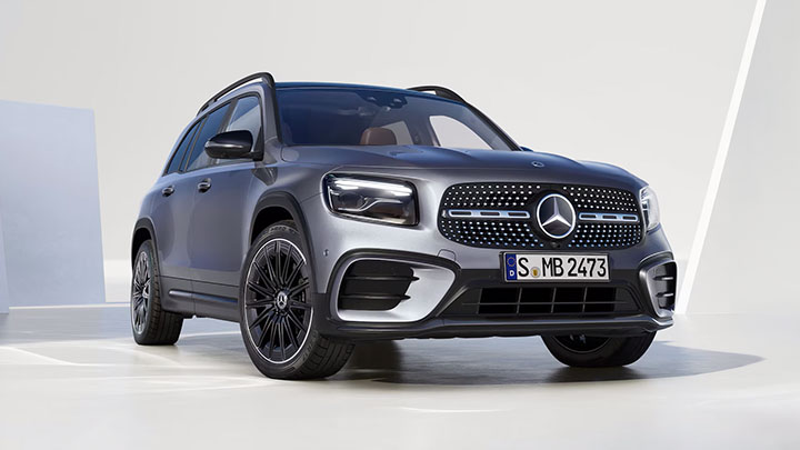 Silver Mercedes-Benz GLB parked in front of a white wall