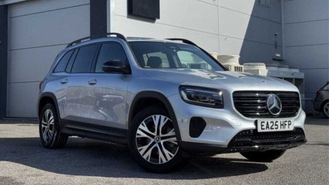 Silver Mercedes-Benz GLB parked in front of a white garage