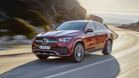 Red Mercedes-Benz GLE Coupe Exterior Driving Front on Mountain Road