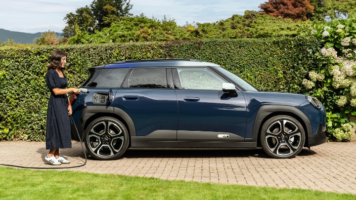 Blue Mini Aceman charging on driveway