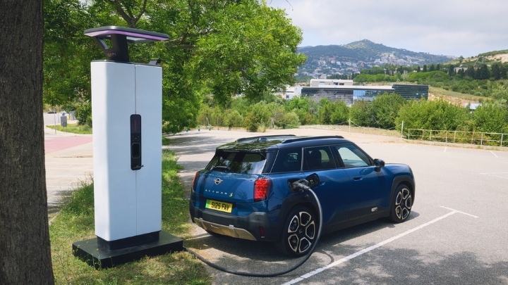 Blue Mini Aceman charging in public