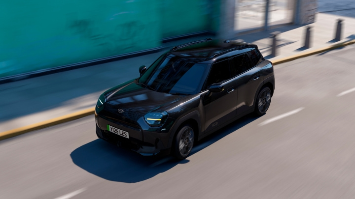MINI Countryman Monochrome in black driving through city, overhead three-quarter view