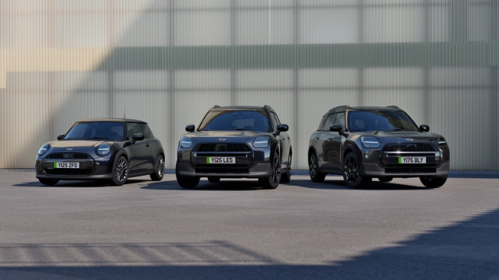 MINI lineup including Cooper and Countryman models in Monochrome trim outdoors