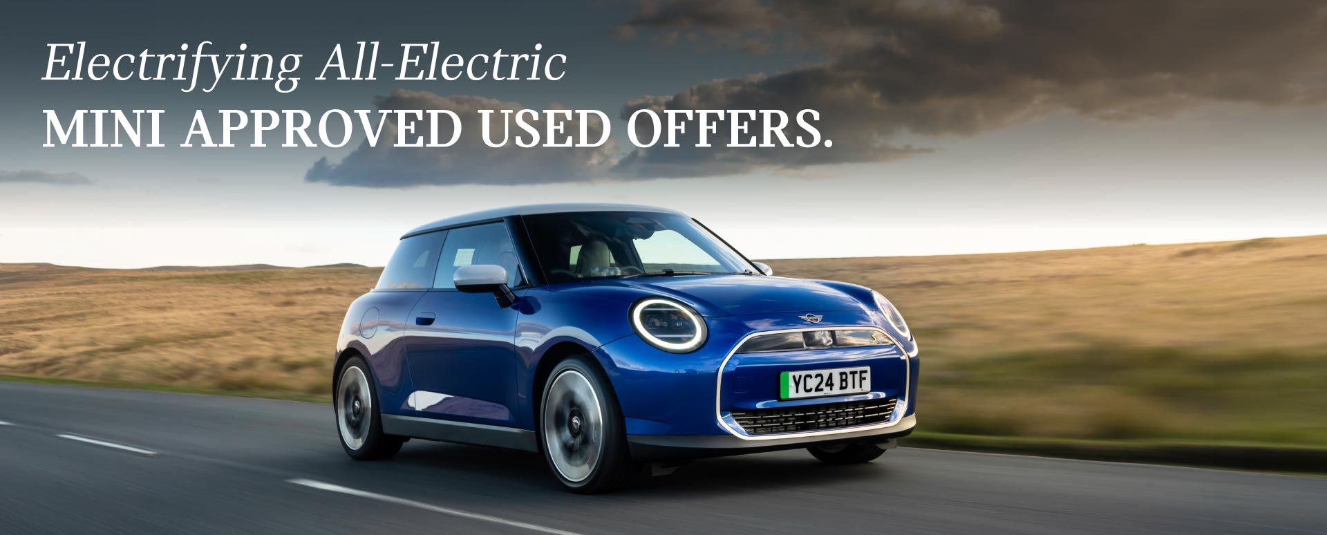 Blue MINI Driving Down Country Road