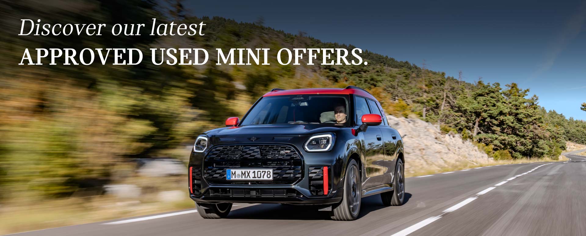 A fast driving black MINI vehicle with red trim. Promotional text overlay.