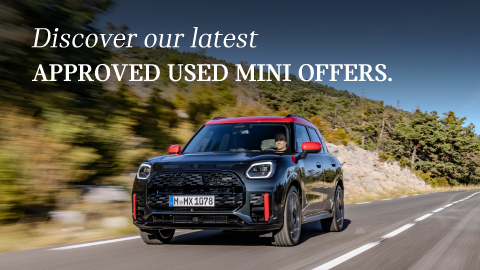 A fast driving black MINI vehicle with red trim. Promotional text overlay.