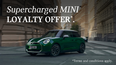 MINI Driving Around a City Corner