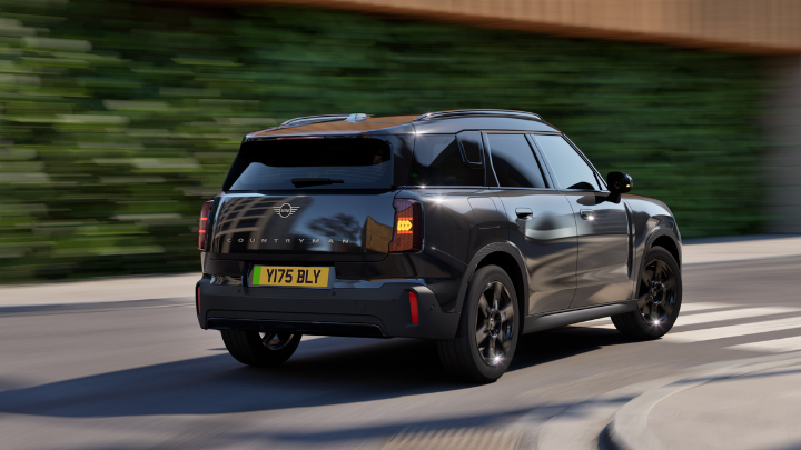 Rear Shot Black MINI Countryman Driving Around a Corner