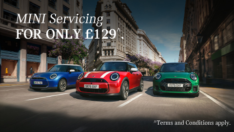 Blue, Red and Green MINI vehicle driving together on a city road. White promotional text overlay