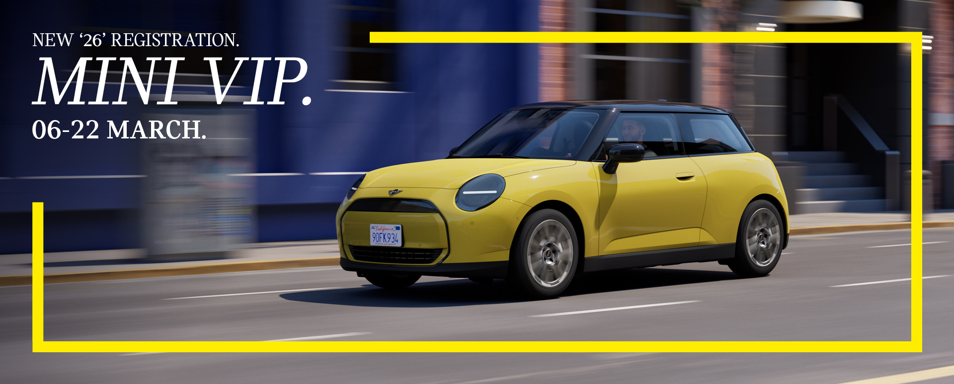 Yellow MINI car action shot on a high street. Promotion text overlay with yellow border.