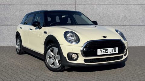 White MINI Clubman Classic parked in front of a grey wall