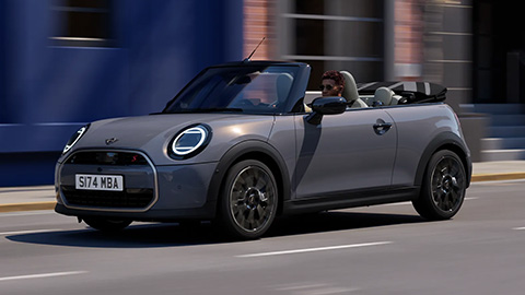 Grey MINI Convertible driving on the road