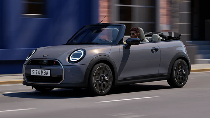 Grey MINI Convertible driving on the road