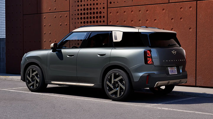 Grey MINI Countryman parked in front of an orange wall