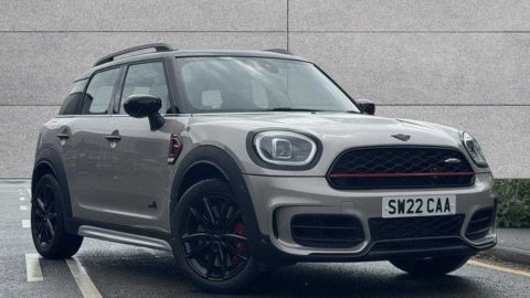 Grey MINI Countryman John Cooper Works parked in front of a grey wall