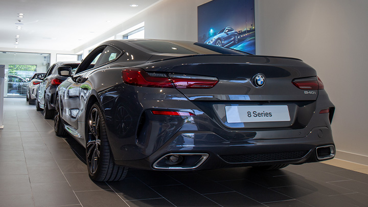 Grey BMW 8 Series parked in showroom