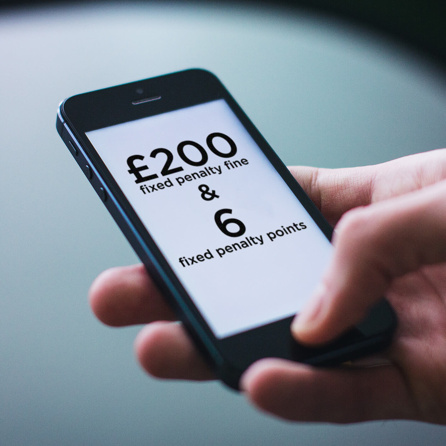 £200 fixed penalty fine using phone while driving