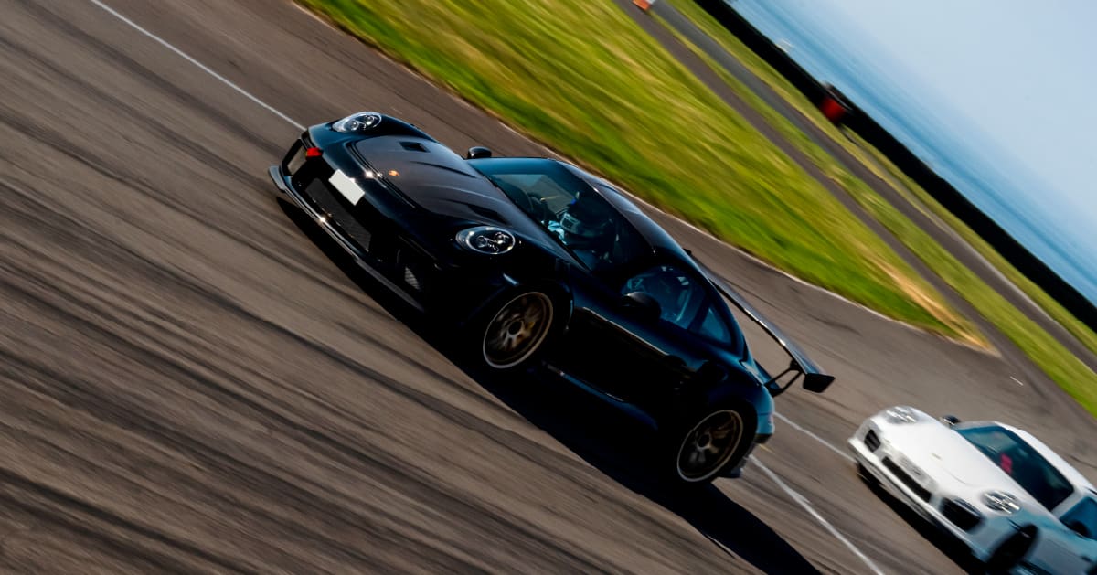 Black Porsche 911 GT3 RS Driving