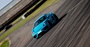 Blue Porsche Cayman GT4 Driving