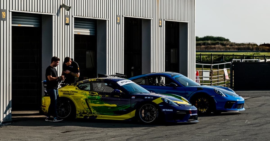 Duo of Porsche Race Cars Pit Lane