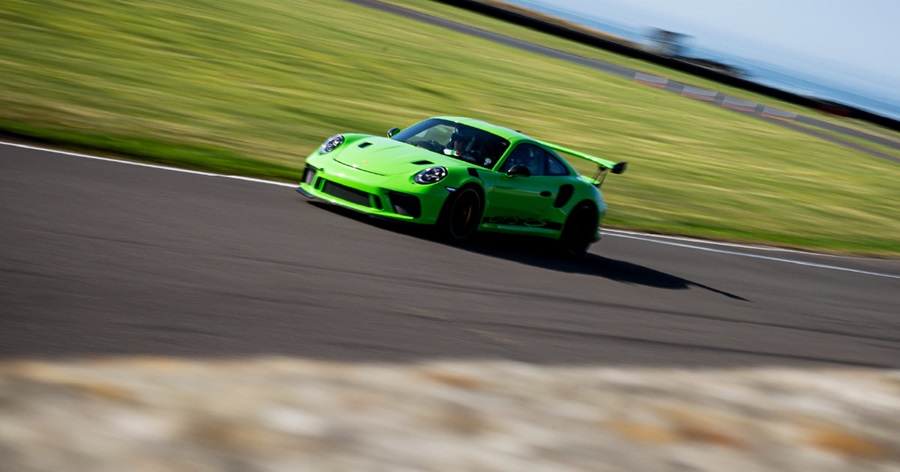 Green Porsche 911 Driving