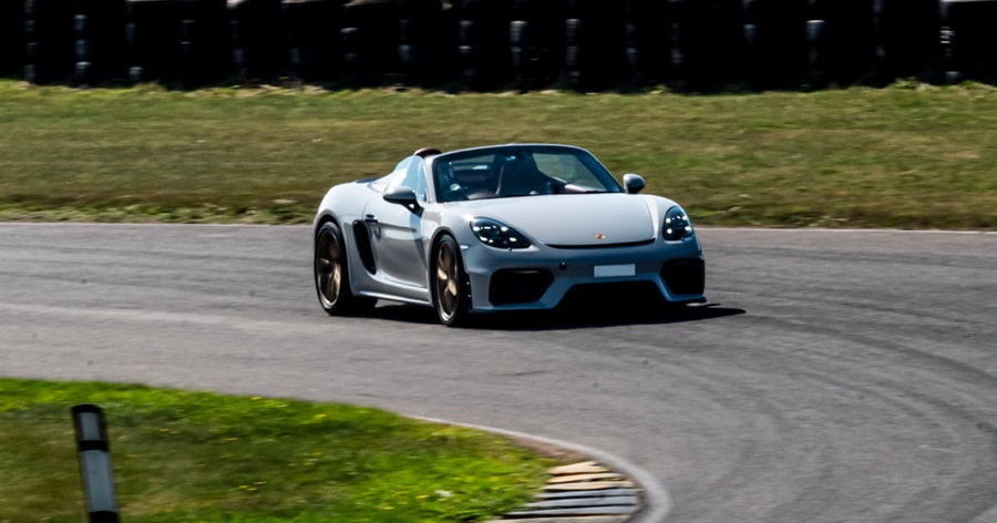 Grey Porsche Cayman Spyder Cornering