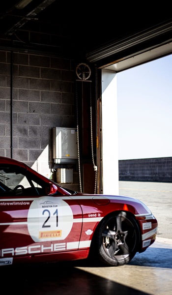 Red Porsche Boxster In Pit Box