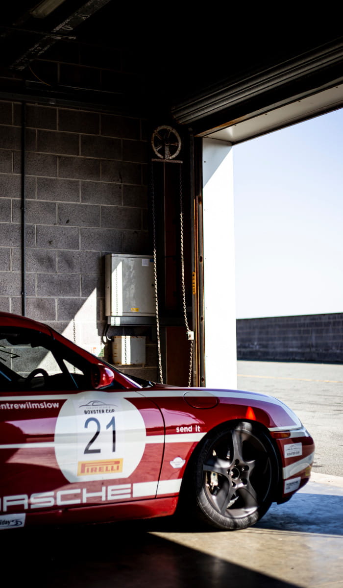 Red Porsche Boxster In Pit Box