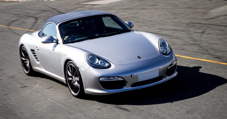 Silver Porsche Boxster Driving