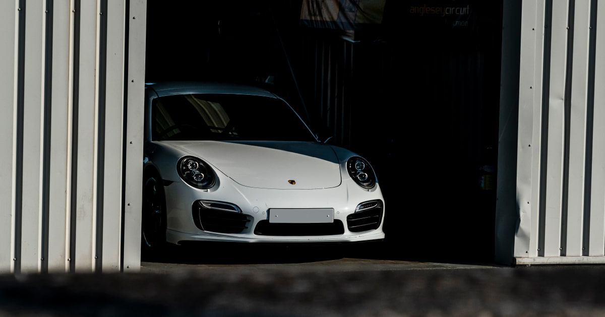 White Porsche 911 In Pit Box