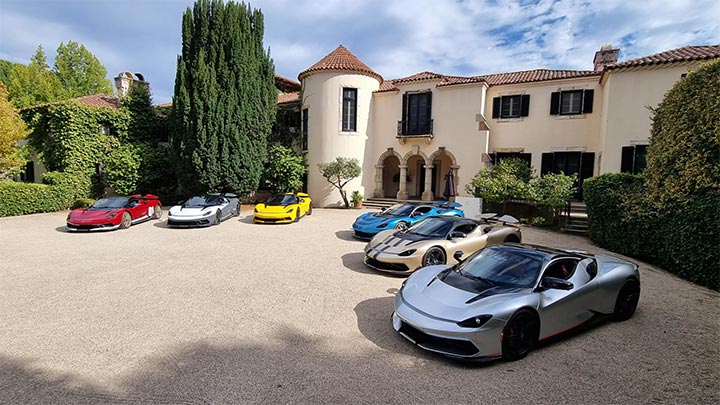 A range of Pininfarina Battista models parked in a car park