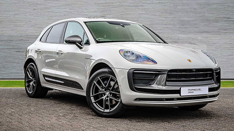 Grey Porsche Macan T parked in front of a grey background