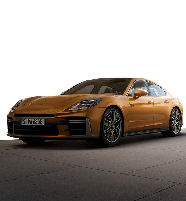 Orange Porsche Panamera driving with a white background