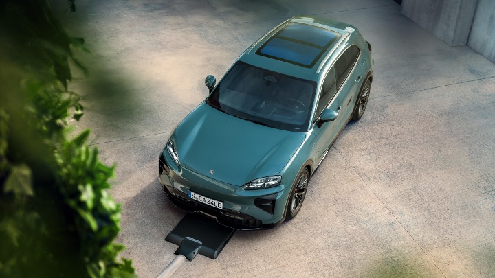 Porsche Cayenne Electric green aerial view with inductive charging pad under car