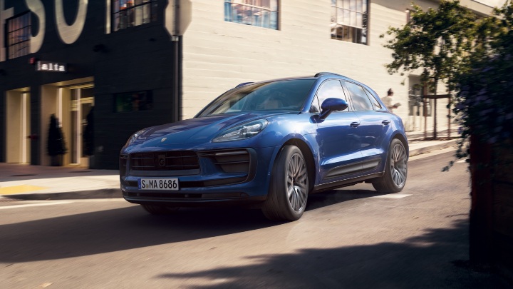 Blue Porsche Macan driving
