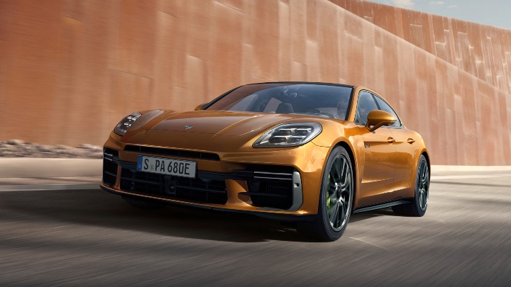 Gold/orange Porsche Panamera driving