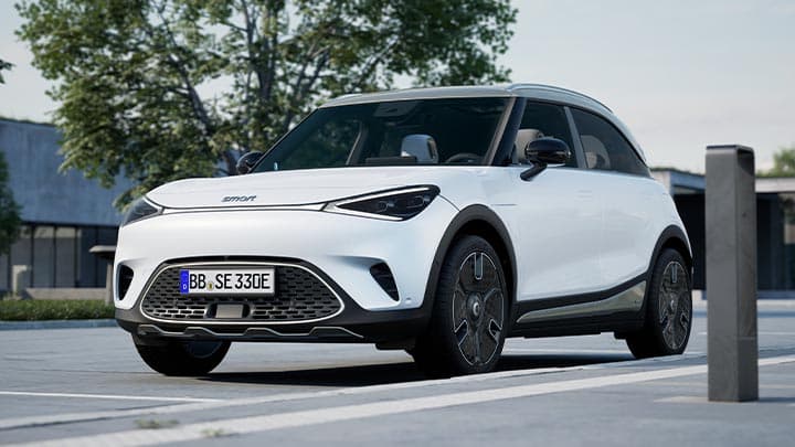 White smart #1 parked next to a charging port