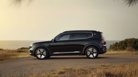 Black Smart Electric Vehicle Parked On Dusty Road Side Angle