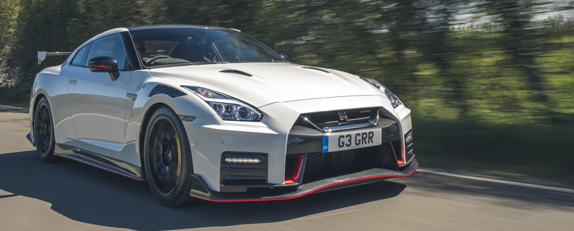 White Nissan GT-R NISMO Exterior Front Driving