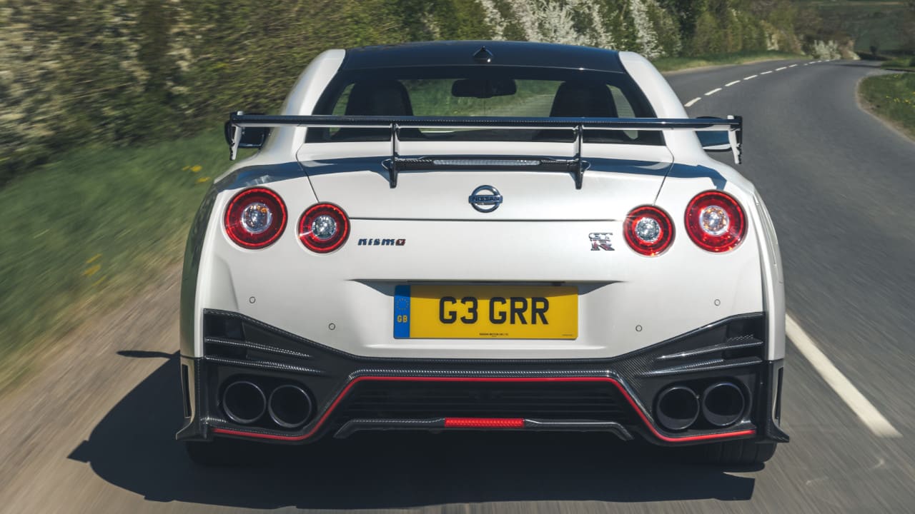 White Nissan GT-R NISMO Exterior Rear Driving