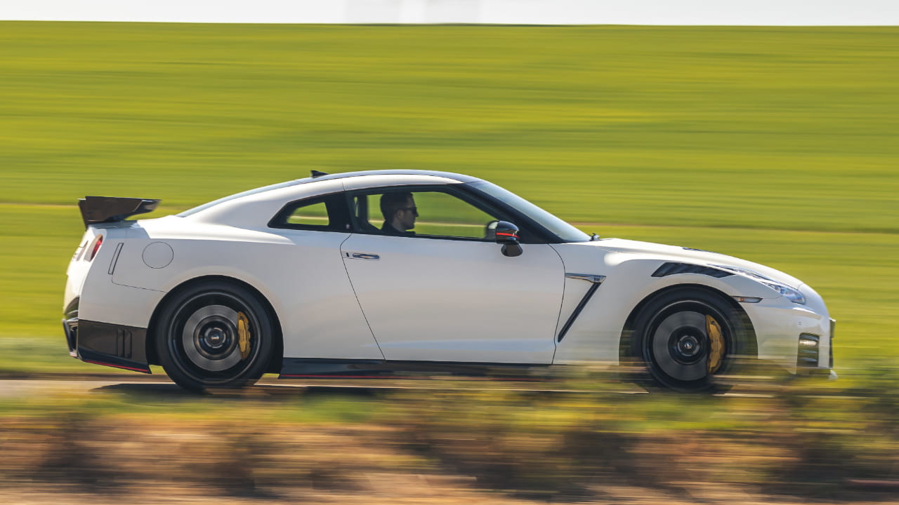 White Nissan GT-R NISMO Exterior Side Driving