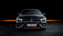 Black Mercedes-Benz CLA Coupe parked.