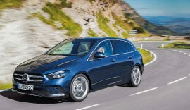 Blue Mercedes-Benz B-Class driving on the road.